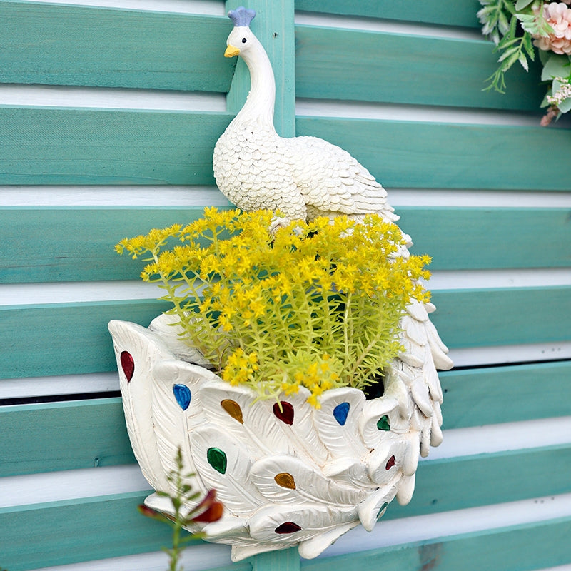 Dekorativ vægpotte i harpiks med påfugledesign til blomster og planter | Påfuglo