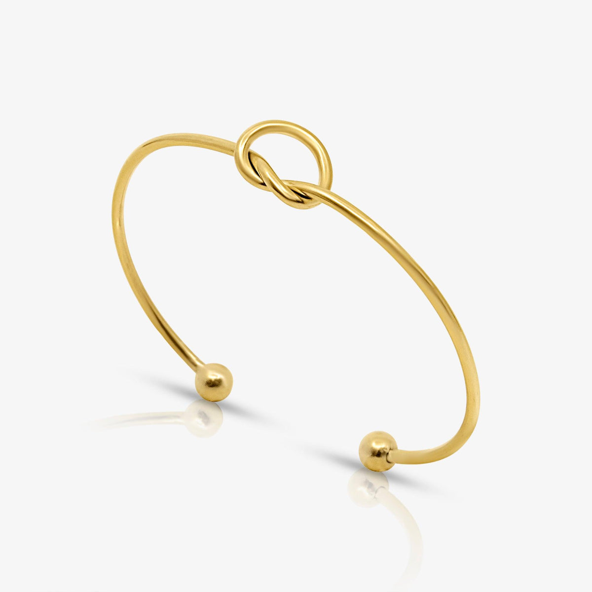 Elegant åben armring med knudemotiv og kugleender til kvinder | Isa